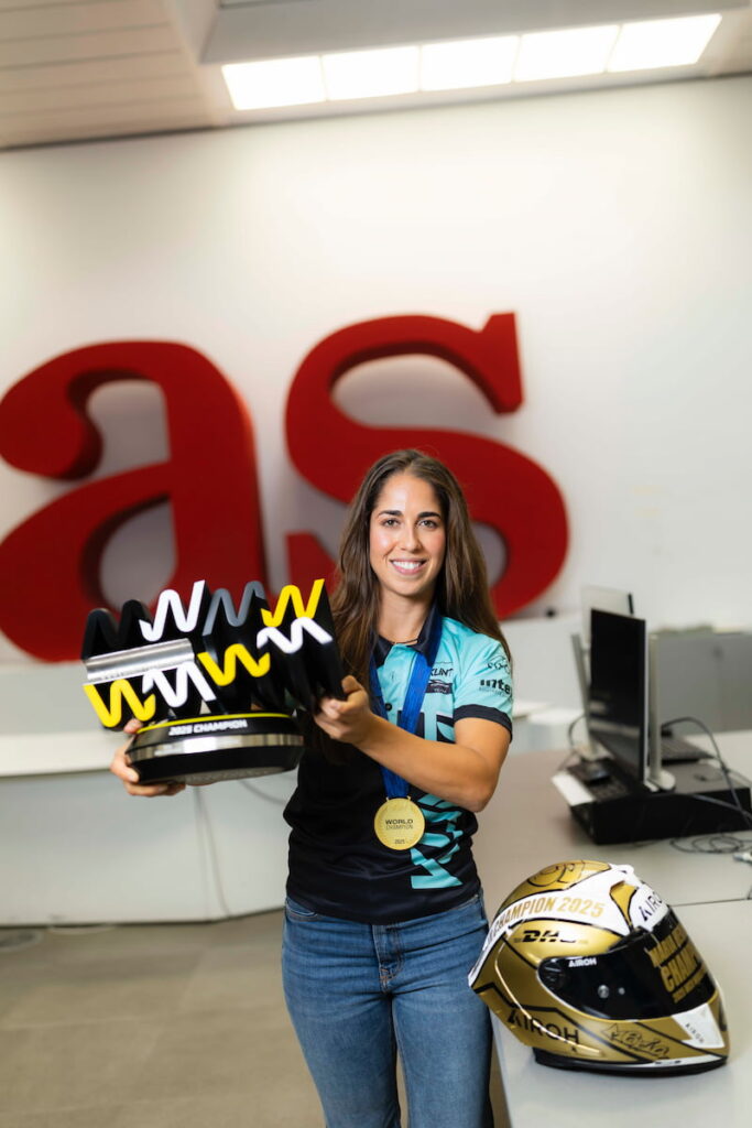 A woman holding a trophy