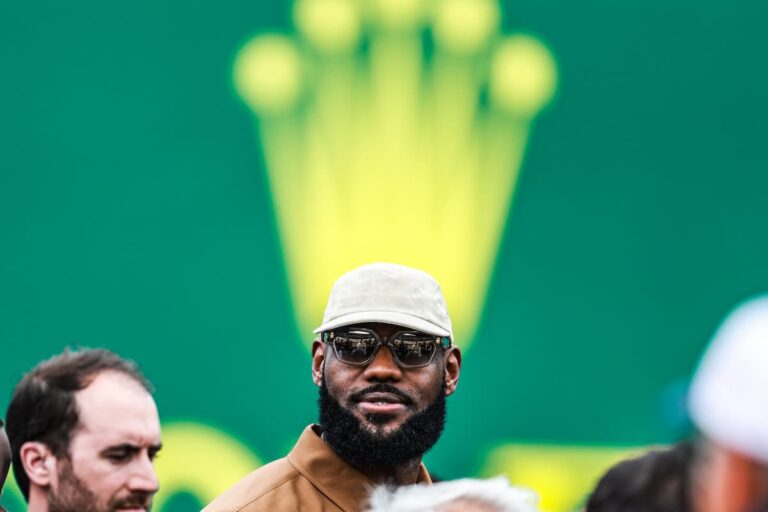 HOME a man with a crown in the background on his head