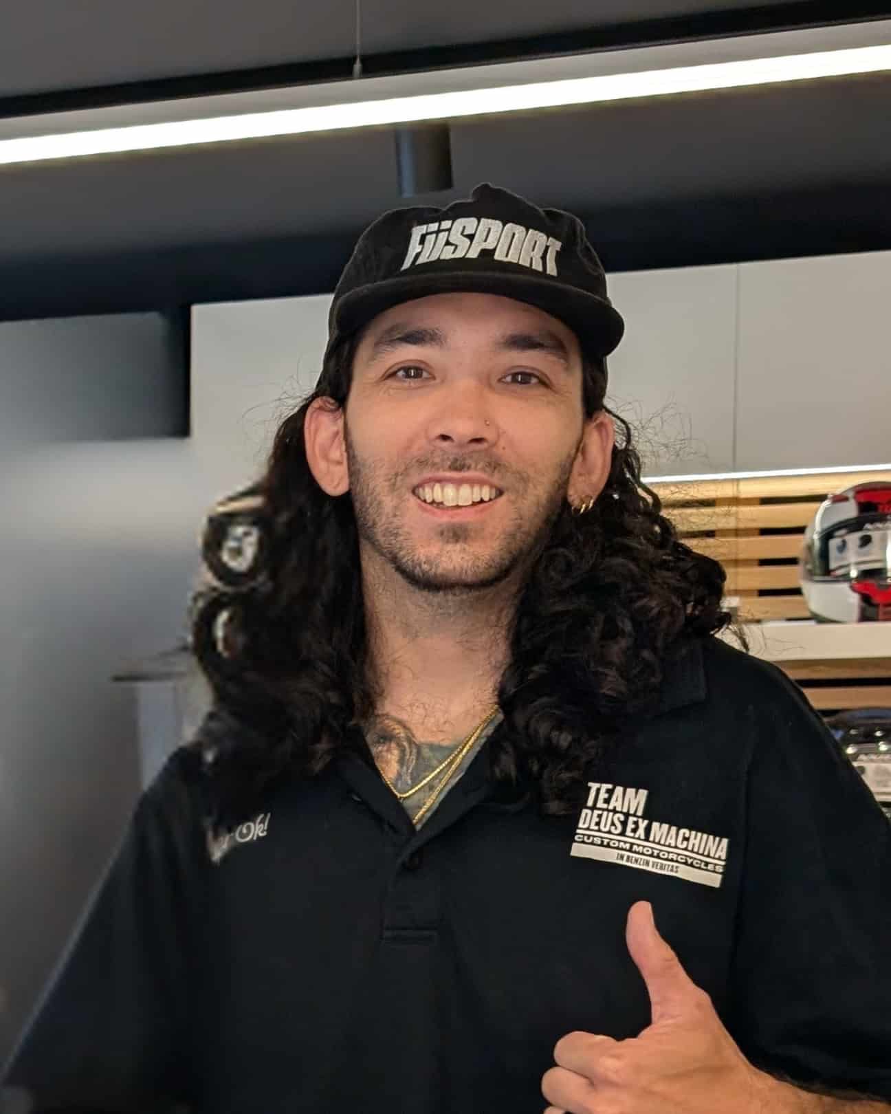 CREW a man looking at the camera with a baseball cap