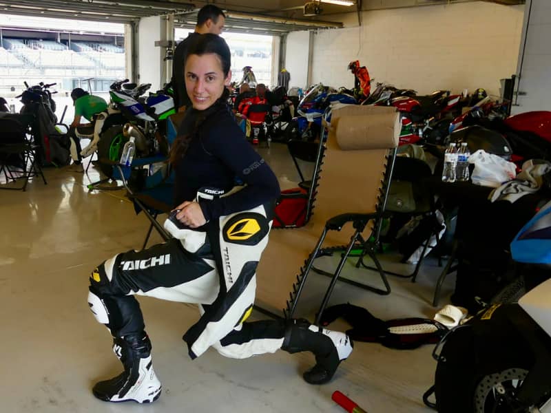 a woman in a race leather suit