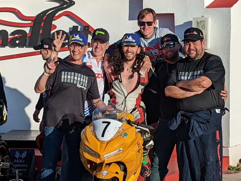 a group of people celebrating the 3rd place