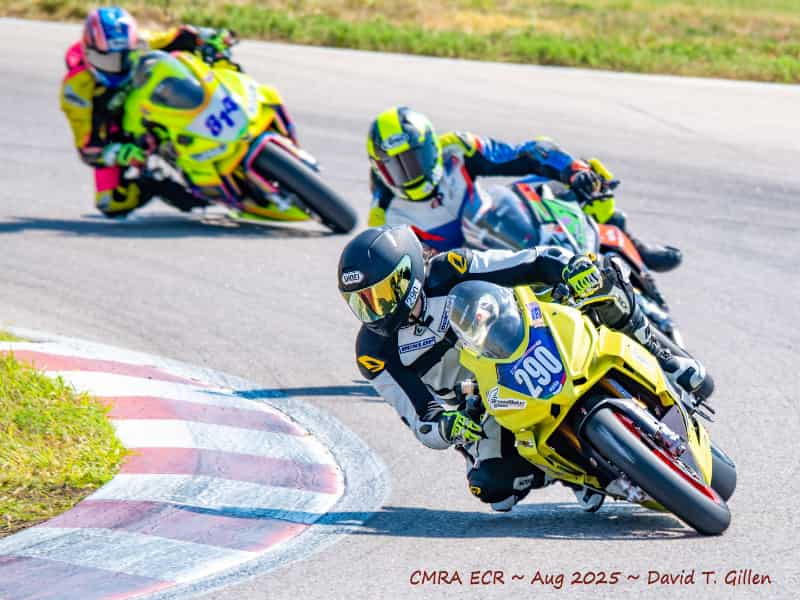 a group of motorcycles racers on the track