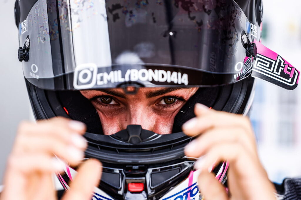 Making Space: How Emily Bondi Is Redefining Where She Belongs Women in a race helmet
