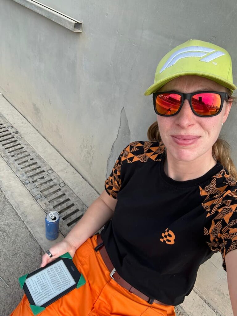 Woman sitting on the ground and cooling down taking a selfie