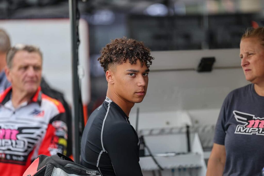 Aiden Sneed a man sitting in the paddock looking at the camera