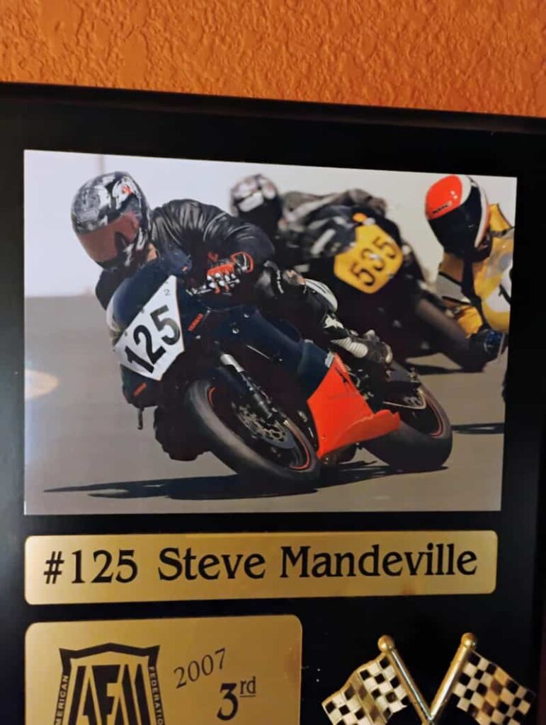 a framed photo with 3rd place certificate