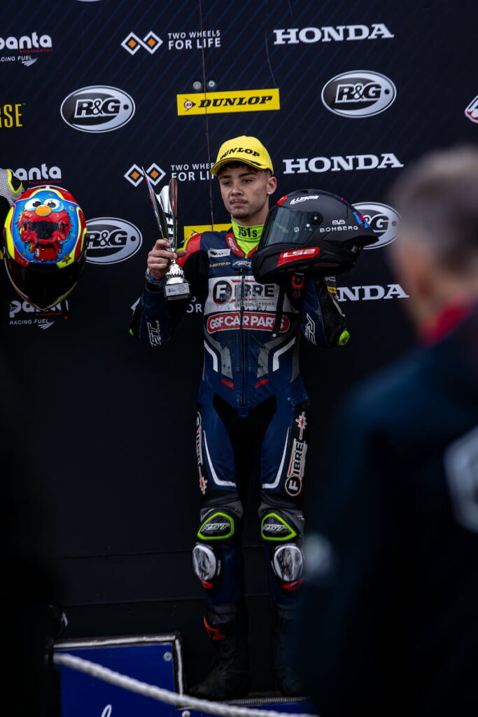 a racer standing at the podium