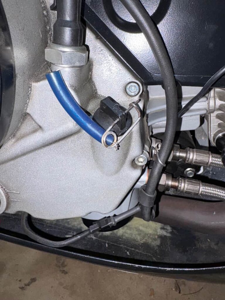 Engine oil fill cap is being safety wired