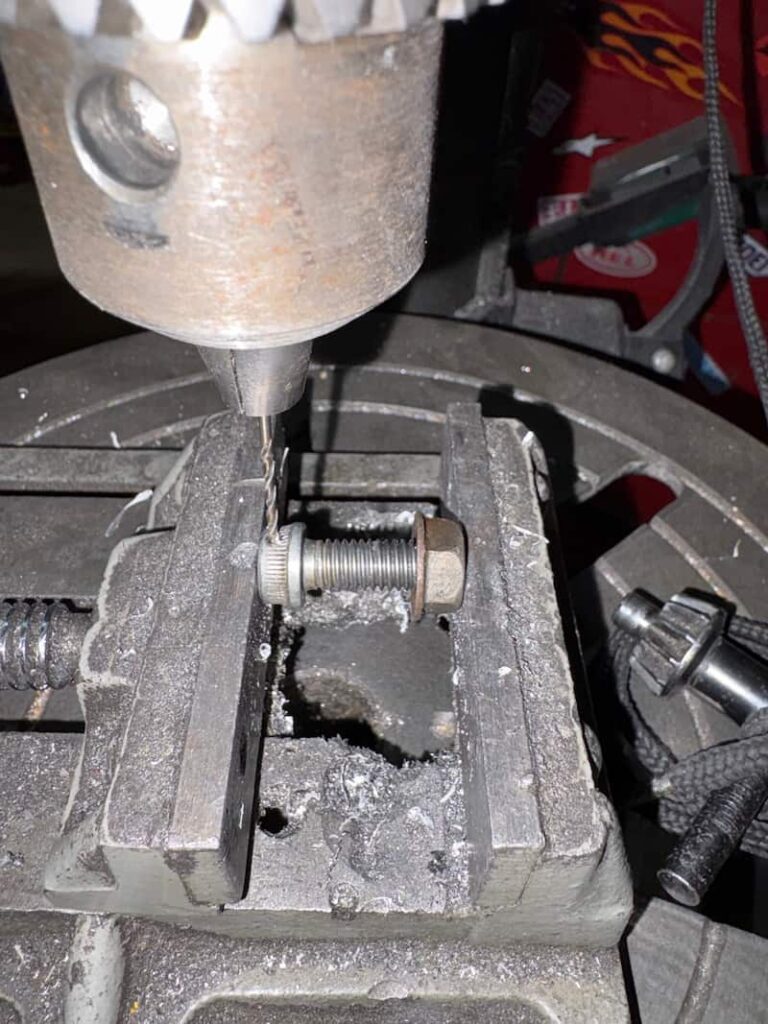 Brake mounting bolt is being drilled out
