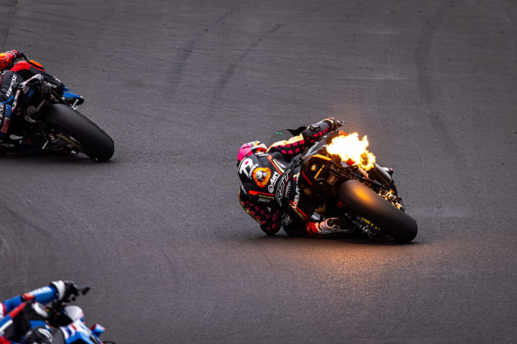 flame coming out of a racing motorcycle exhaust