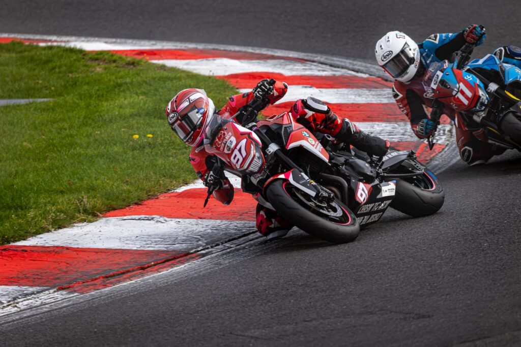 2 motorcycle racers leaned at the apex