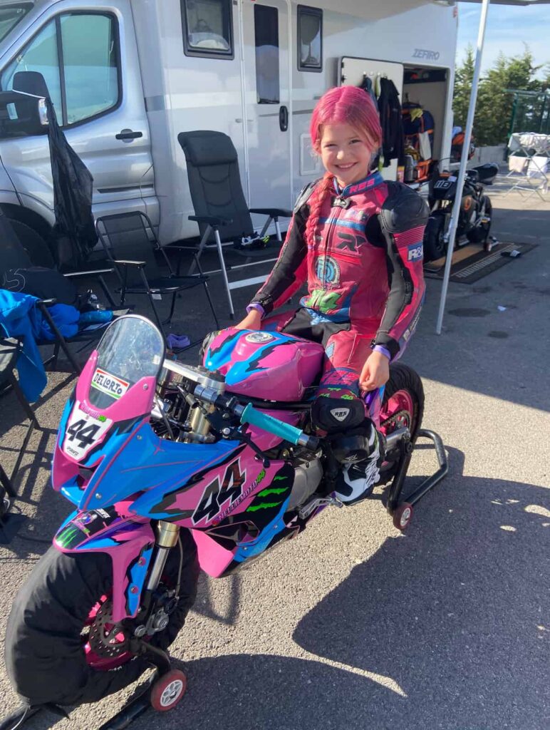 8 year old Nellie Newth on a motorcycle