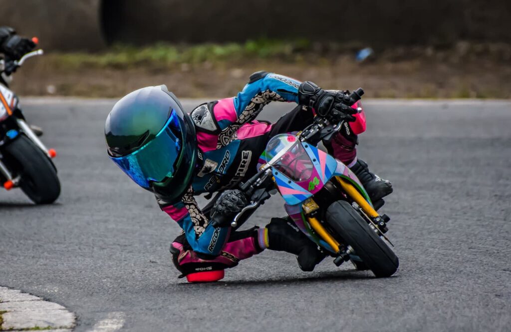 a kid on a mini race bike