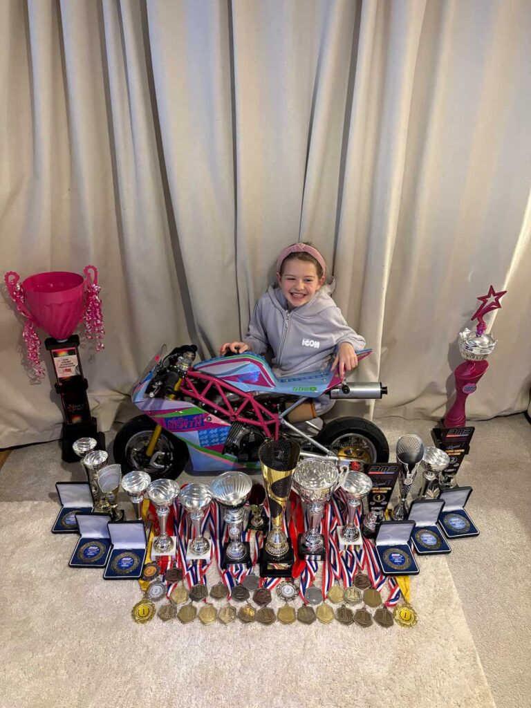 Nellie Newth with her trophies