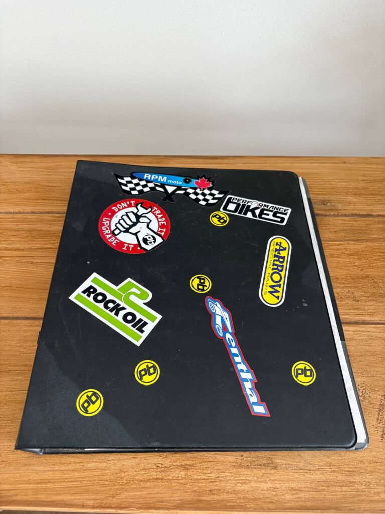 a black binder with stickers