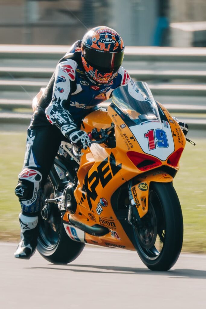 a woman motorcycle racer at the brake zone