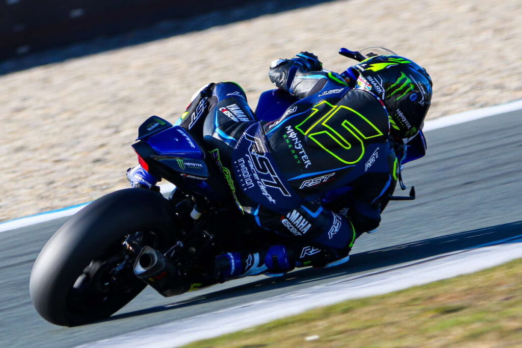 a motorcycle racer leaned into apex