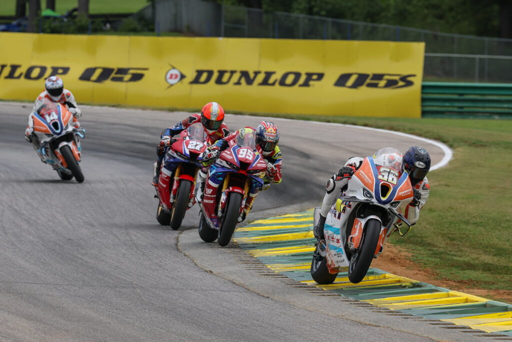 a group of road-racers on track