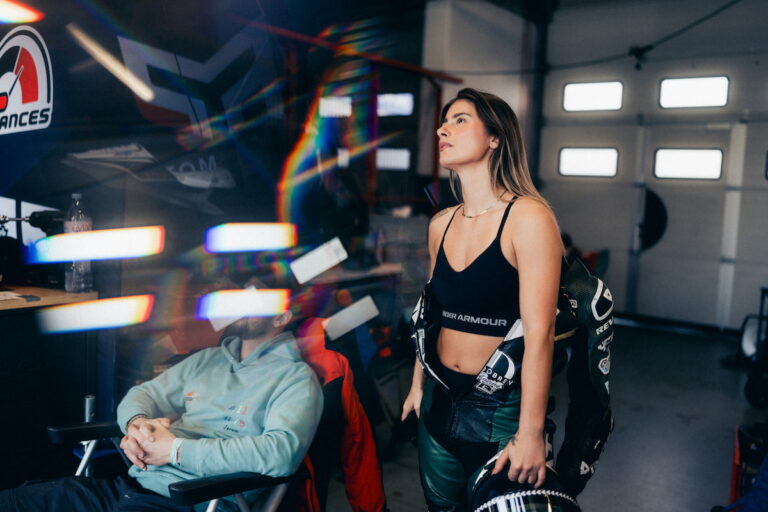 HOME a woman in leather suit